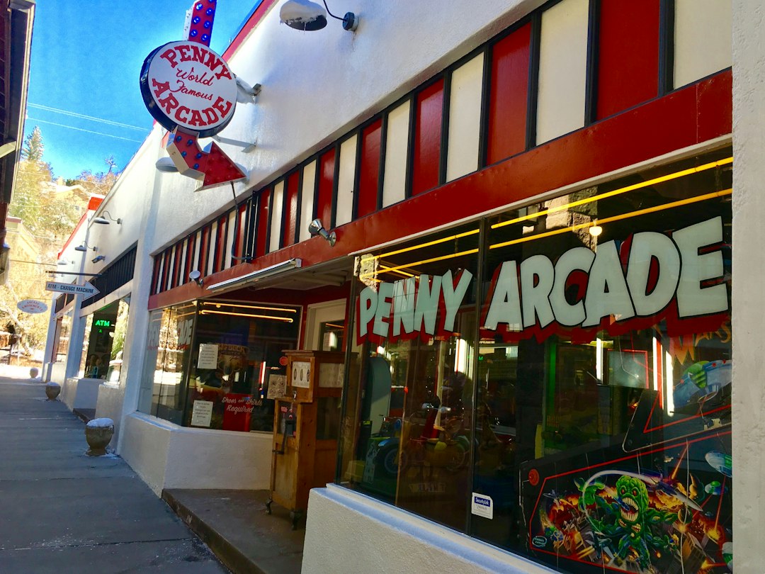 family laughing while playing at the Manitou Springs Penny Arcade