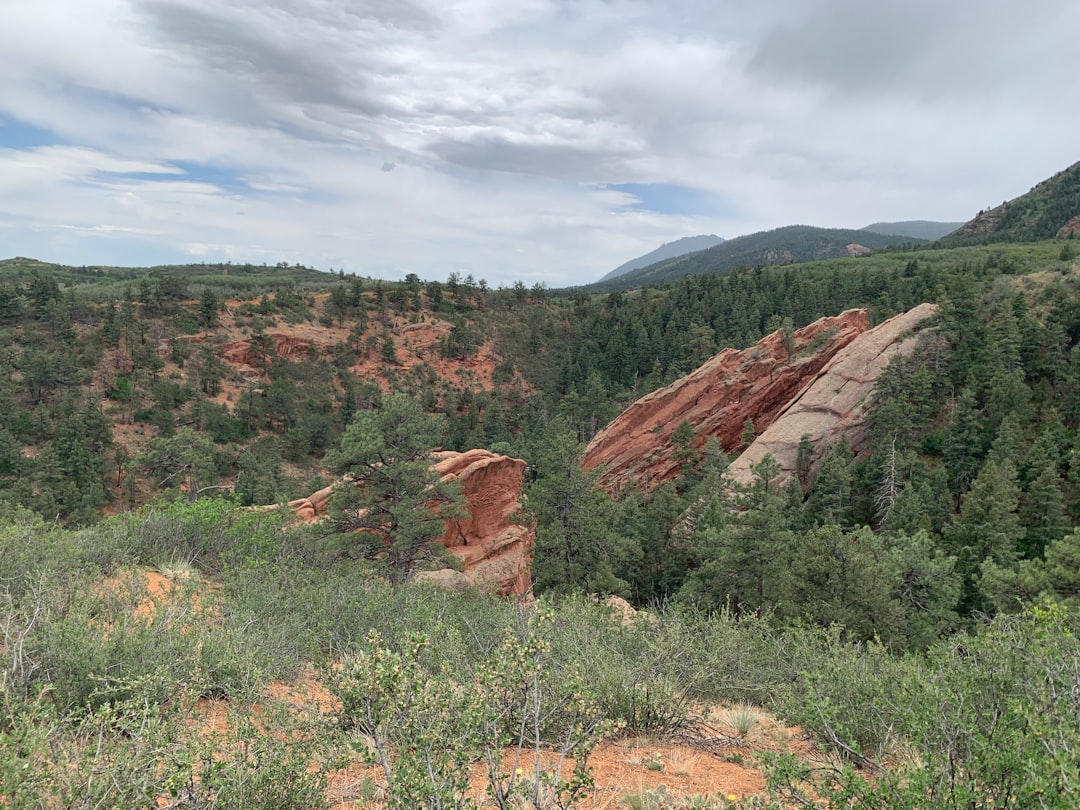 hiker looking at red rock formations in Red Rock Canyon Open Space Colorado