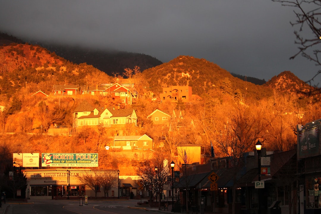 main street of Manitou Springs with colorful storefronts and mountain backdrop
