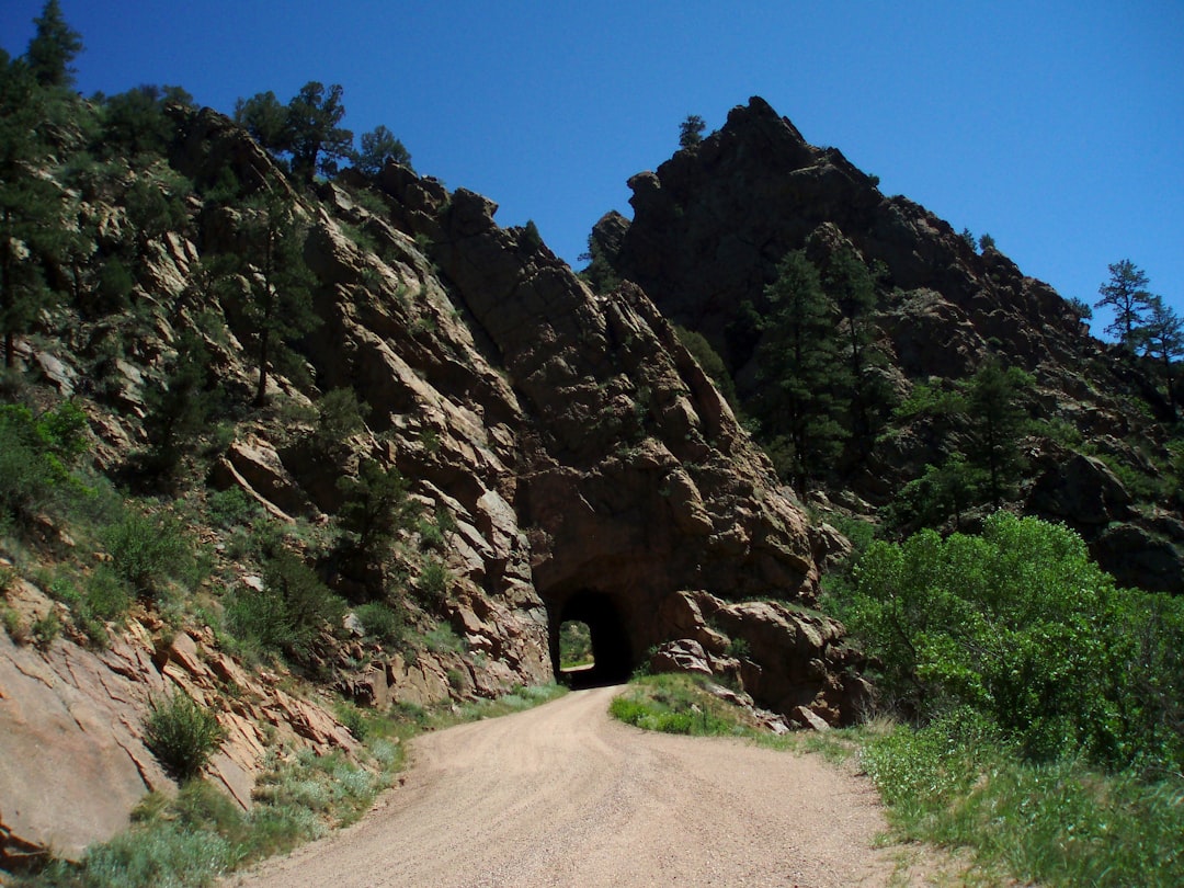 scenic drive on a mountain dirt road with tunnels in Colorado