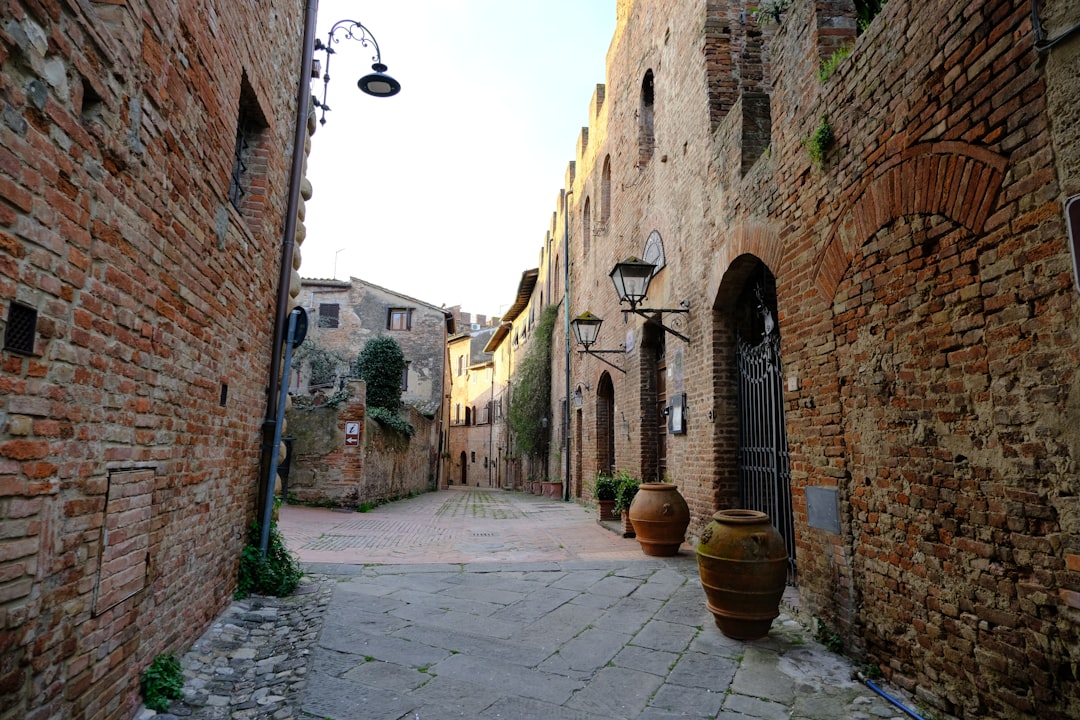 a charming cobblestone street in a small village center with storefronts