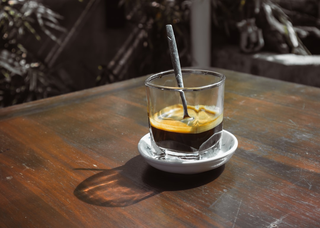 aesthetic espresso drink on a wooden table in a bright cafe