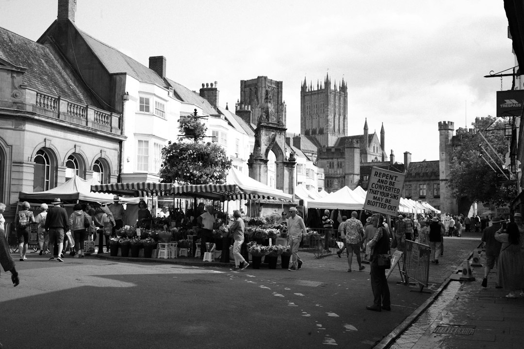 bustling farmers market in a quaint town square with families shopping