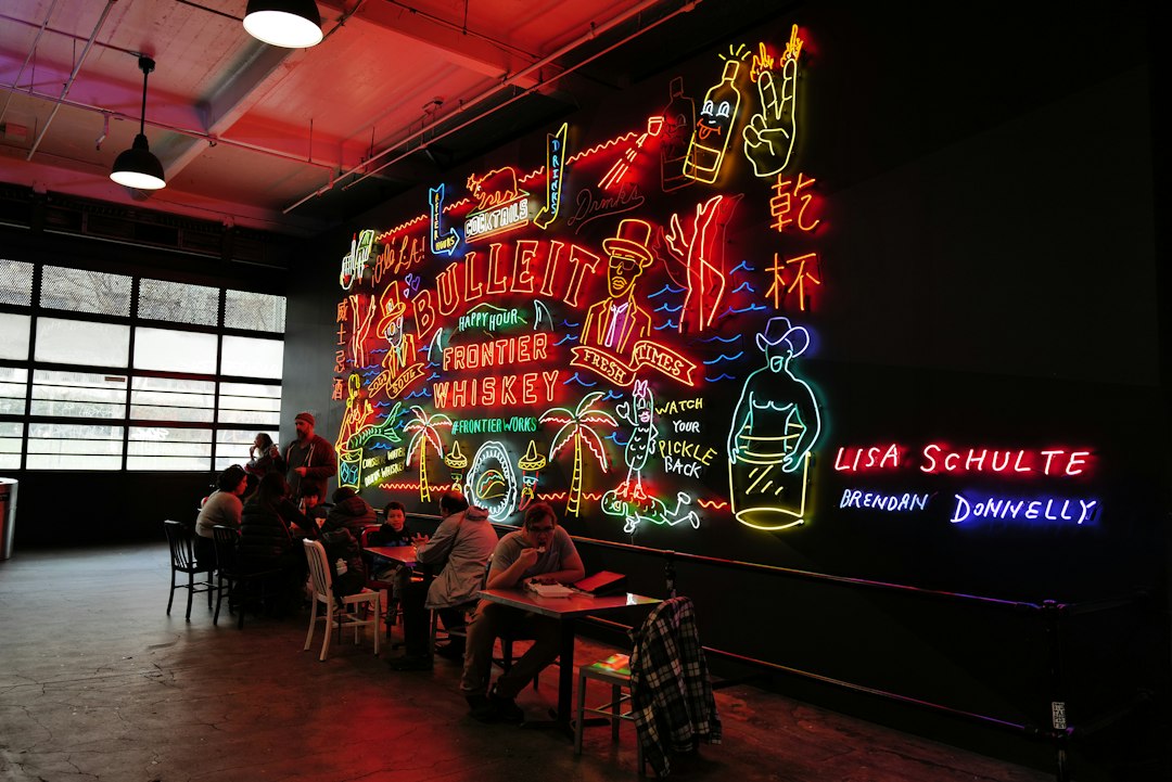 eclectic and funky restaurant interior with neon signs and art