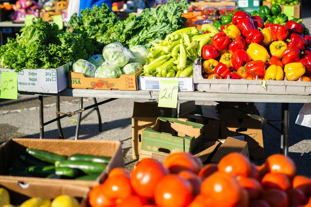 fresh produce and local honey at a vibrant farmers market stall