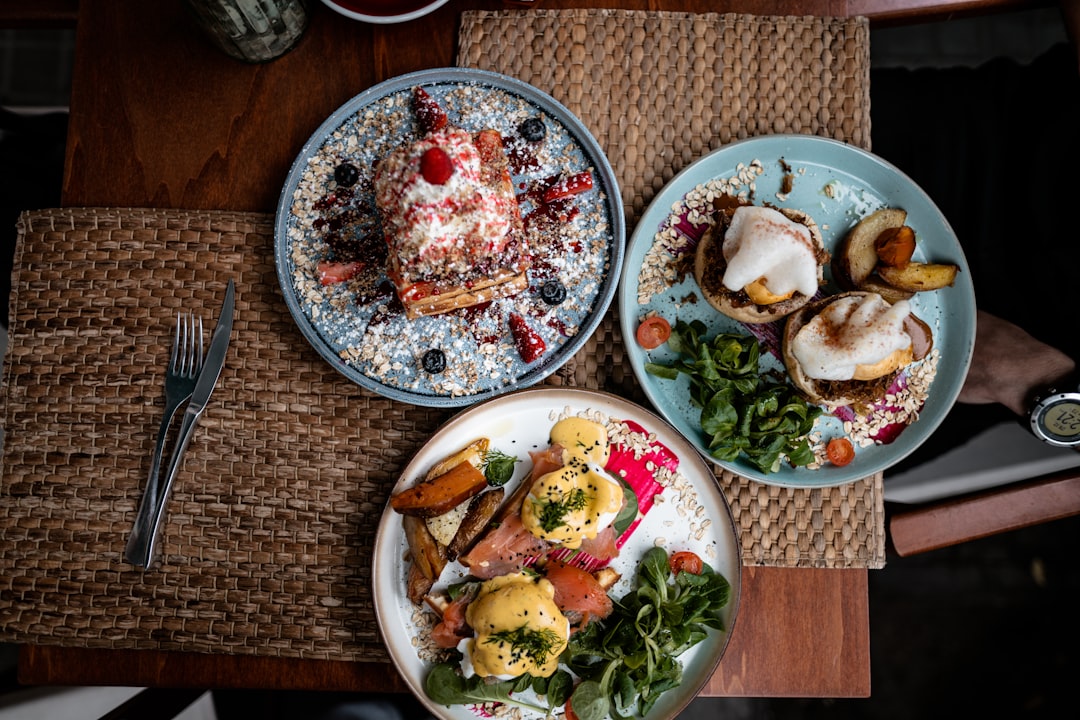 overhead shot of a delicious brunch spread with eggs benedict and mimosas