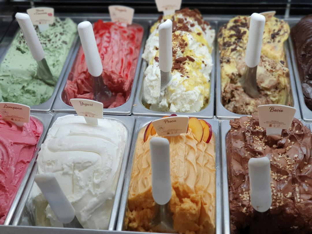scoops of colorful artisanal ice cream in a cone