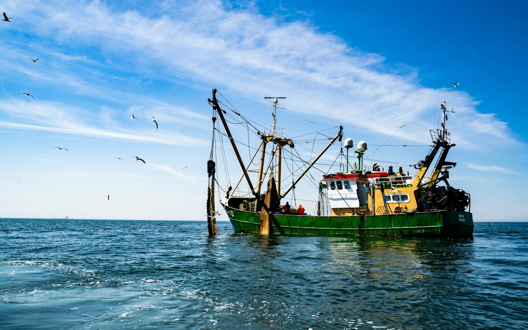 deep-sea fishing boat on the open water with lines out