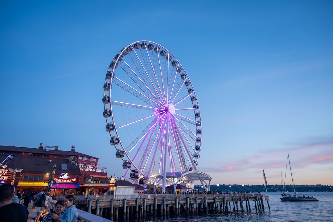 the illuminated SkyWheel at Pier Park against a twilight sky
