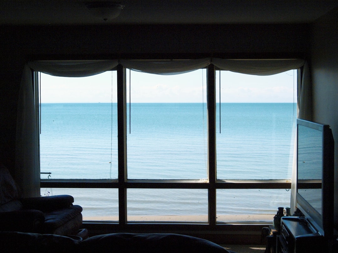 bright beach house interior with coastal chic decor and large windows