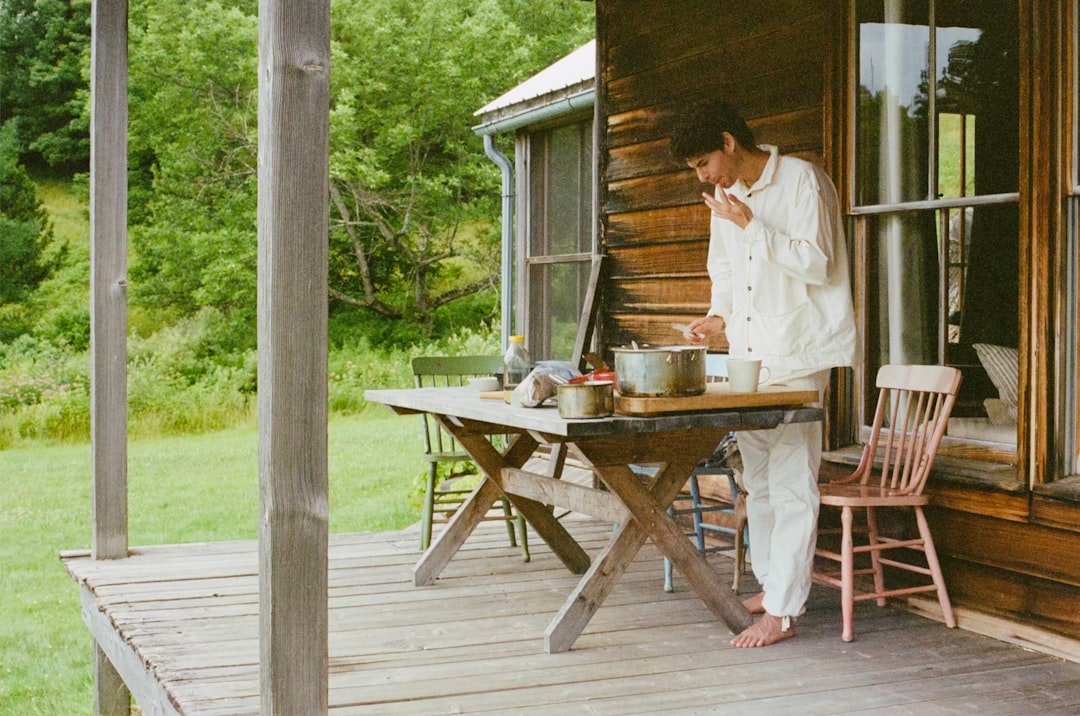 happy family relaxing on the porch of a cabin