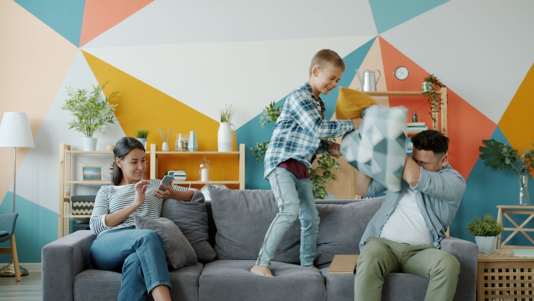 kids playing a board game with their parents in a cozy living room
