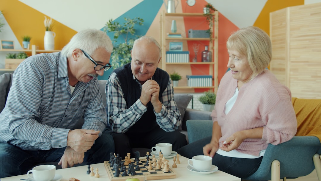 smiling family playing a board game in a cozy living room