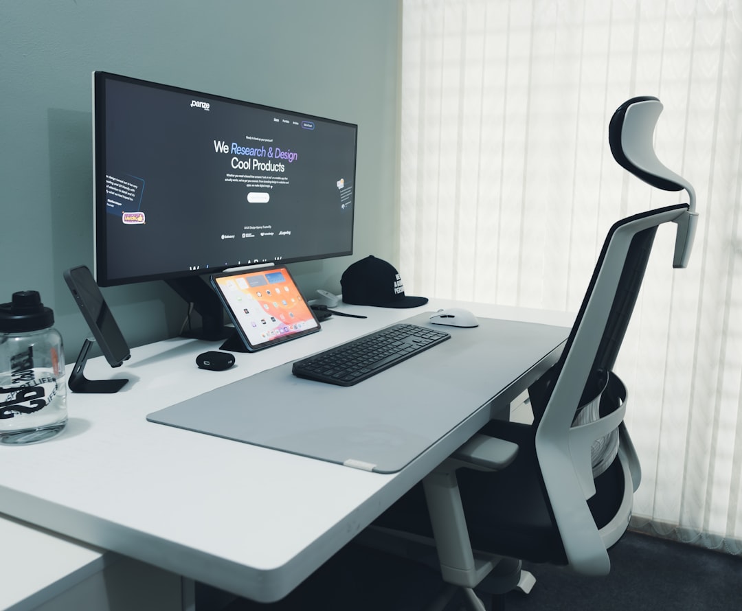 stylish dedicated home office workspace with an ergonomic chair and large monitor