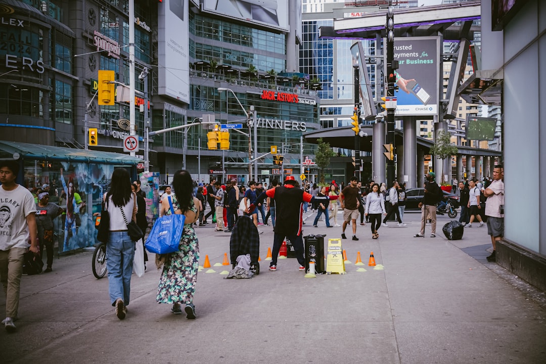 a vibrant downtown street with shops and people walking