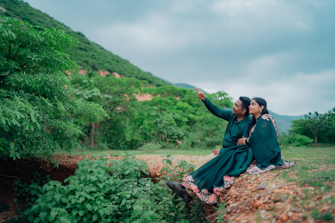 couple taking a selfie with a beautiful mountain view in the background