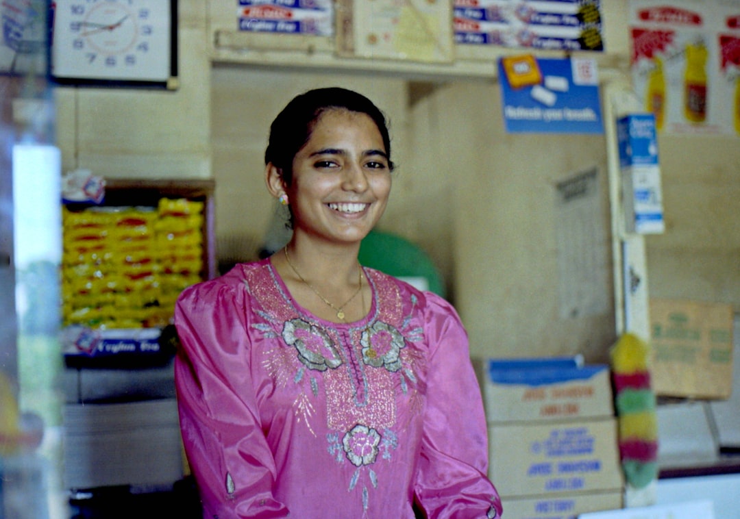 friendly small business owner smiling in their shop