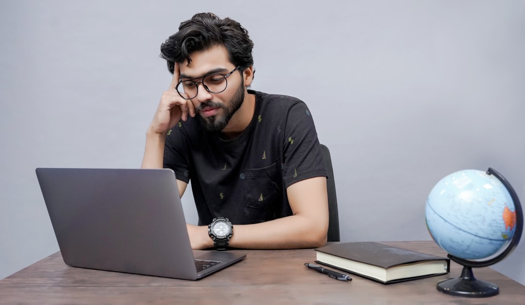 frustrated traveler looking at laptop screen