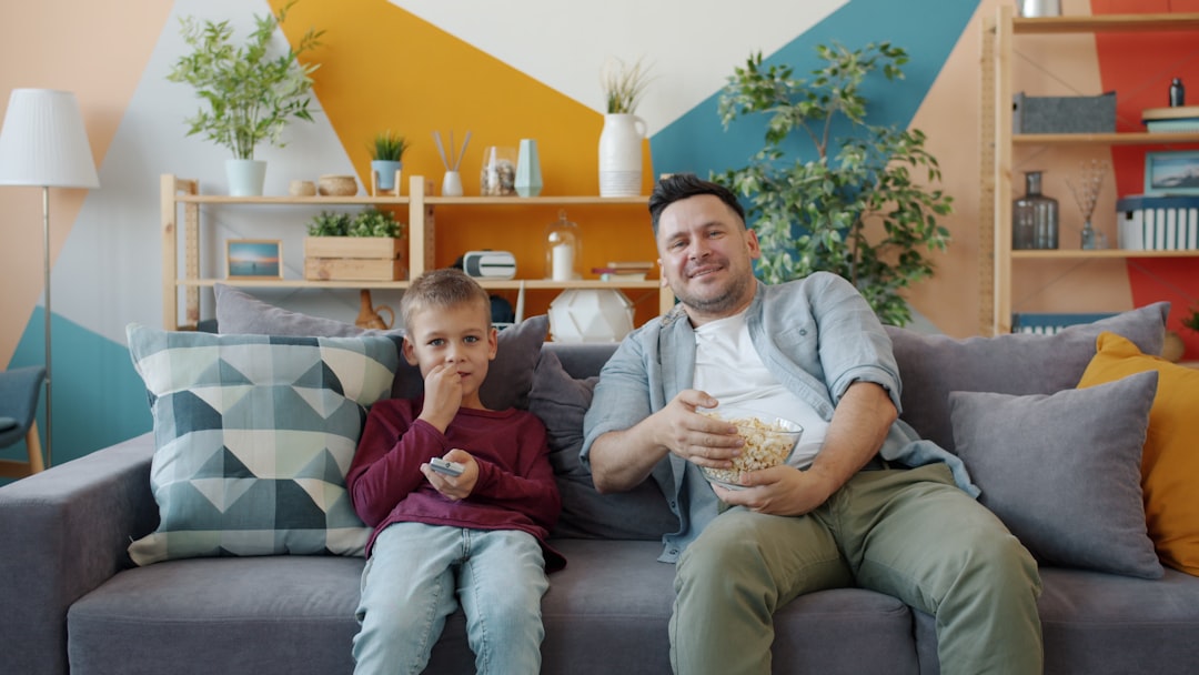 happy family laughing and playing board games in a cozy living room
