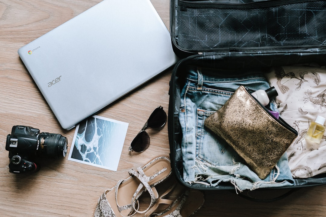 neatly packed suitcase with clothes and travel essentials